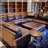 F10. Italian leather 6-piecce sectional sofa with matching ottoman. 111" x 163" x 111" 
